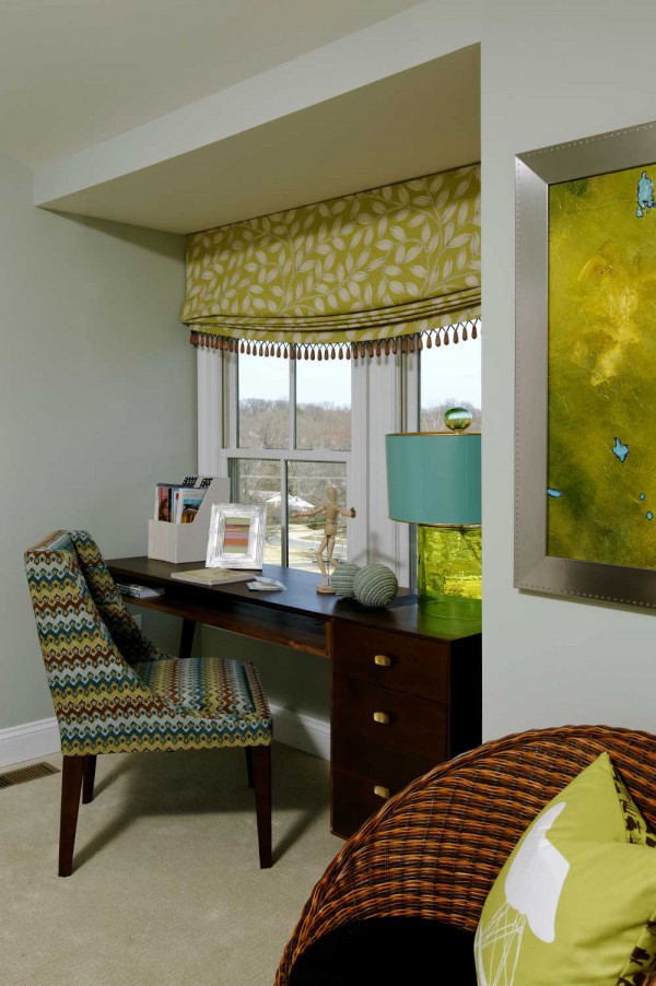 Wooden tassle trim, a lively mix of patterns and a textural glass lamp add earthy style to a study area anchored by a mid-century style desk. </br>(Bethesda, Maryland)